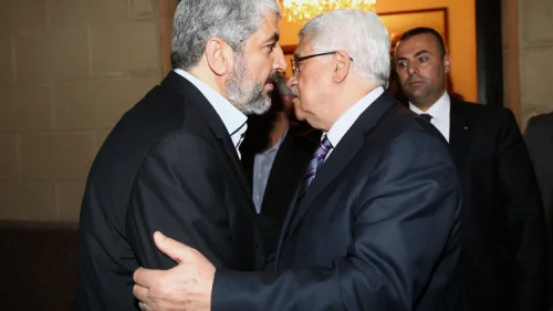 Hamas leader Khaleed Meshaal (left) meets with Palestinian Authority leader Mahmoud Abbas in Cairo, to implement the terms of a reconciliation deal they signed in the Egyptian capital in May 2011, which called for an interim government and general elections in a year, on Feb. 23, 2012. Photo by Mohammed al-Hums/Flash90.
