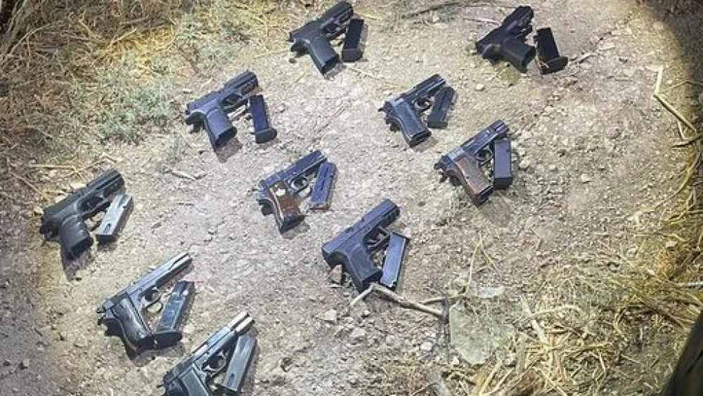 Handguns and ammunition seized by the Israeli military on the border with Jordan, Aug. 27, 2022. Credit: Israel Defense Forces.