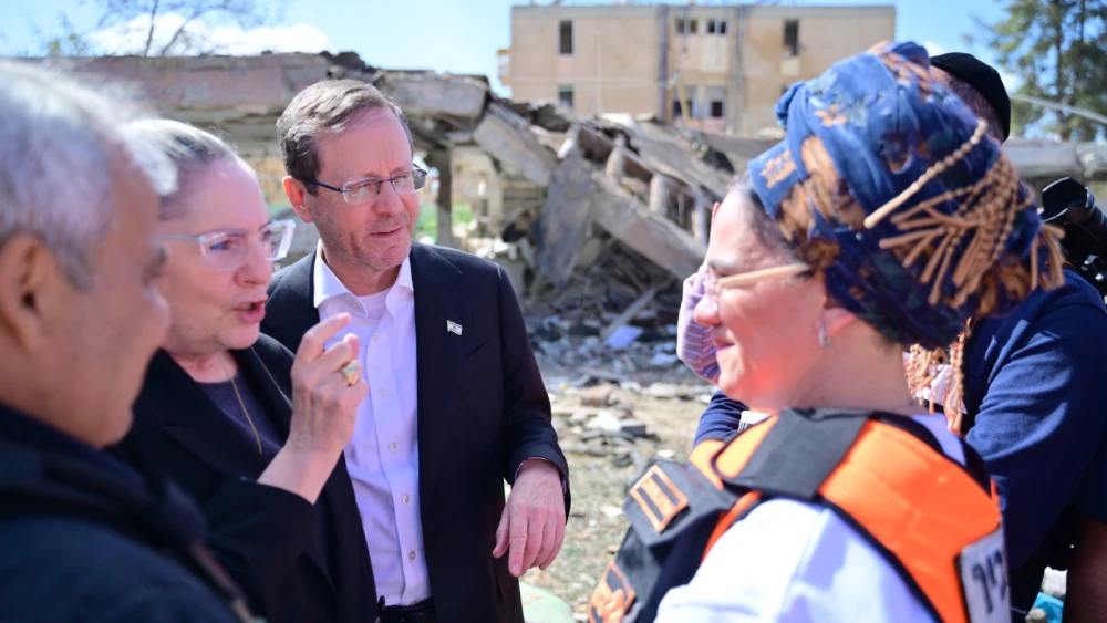 President Herzog at the site in Dimona with United Hatzalah volunteers