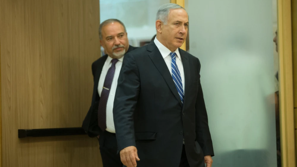 Israeli Prime Minister Benjamin Netanyahu and Defence Minister Avigdor Lieberman arrive at a joint press conference in the Knesset on May 30, 2016. Photo by Yonatan Sindel/Flash90.
