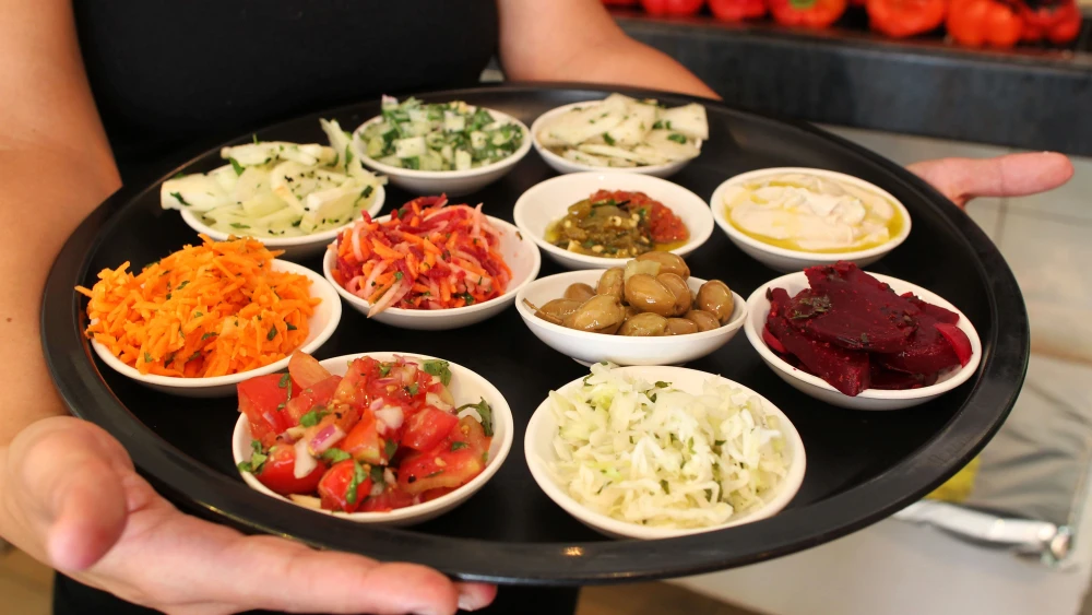 Salads served in the Fortuna restaurant at the Mahane Yehuda open-air market in Jerusalem, July 3 2011. Photo by Nati Shohat/Flash90.