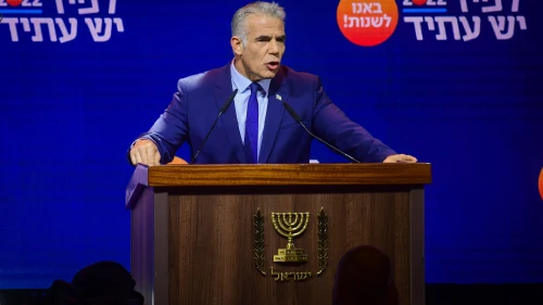 Prime Minister and Yesh Atid chairman Yair Lapid speaks to party members during a Yesh Atid party conference in Tel Aviv, August 3, 2022. Photo by Avshalom Sassoni/Flash90