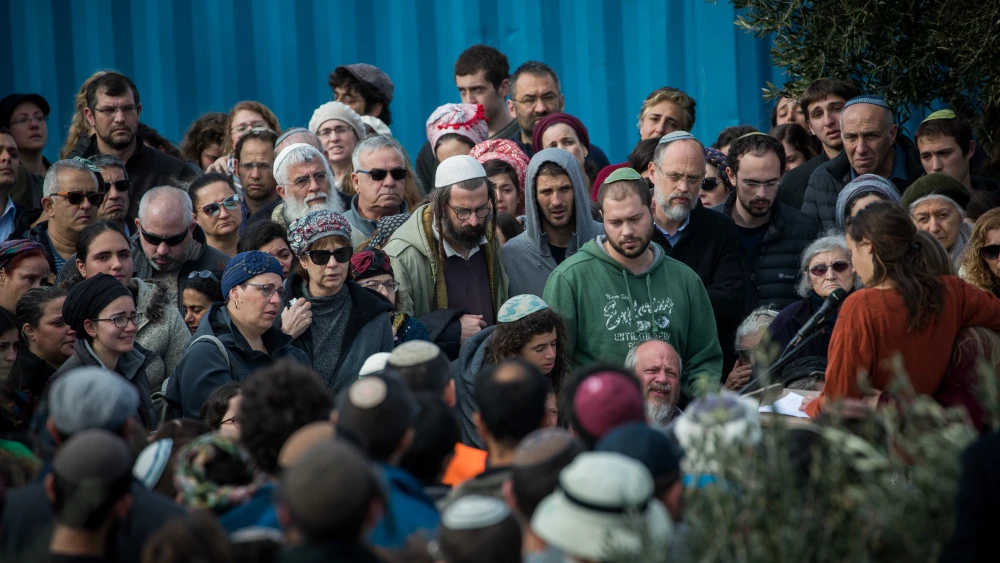 Friends and family members attend the funeral of 19-year-old Ori Ansbacher in the Jewish settlement of Tekoa on Feb. 8, 2019. The young woman was found dead last night in Ein Yael, in the outskirts of Jerusalem, in what police are suspecting is a rape and murder. Credit: Yonatan Sindel/Flash90.