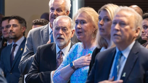 Janet Huckabee, third from right, and her husband Mike Huckabee and Mike Evans sing the American anthem at the Friends of Zion Heritage Center in Jerusalem, Israel on May 6, 2025. Photo by David Sa'ad.