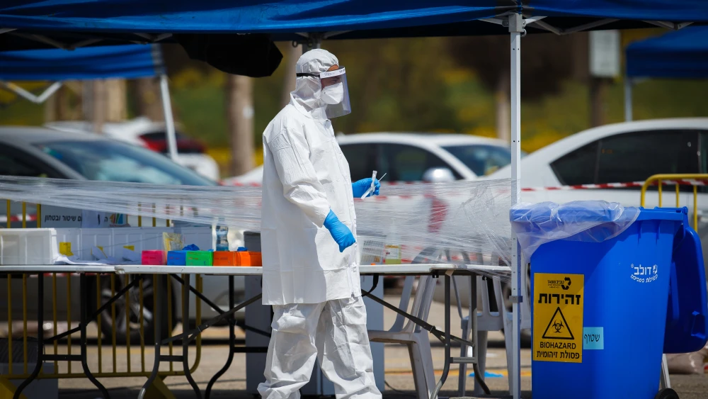 Israel's Magen David Adom national emergency service drive-through complex in Ashdod allows people to get tested while still sitting in their cars, April 1, 2020. Photo by Flash90.