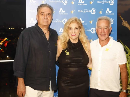 Sylvan Adams (right) hosts an event for Make-A-Wish Israel at his Tel Aviv home with organization co-founders Denise and Avi Bar-Aharon. Credit: @lans production, Aug. 27, 2025.