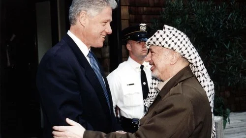 Former U.S. President Bill Clinton (left) with former Palestinian leader Yasser Arafat. In this undated handout from the Palestinian Authorities is Yasser Arafat and Bill Clinton. Arafat rejected the December 2000 “Clinton Parameters,” a State Department-drafted peace plan that called for a Palestinian state in 95 percent of the disputed territories as well as Palestinian sovereignty over the Temple Mount and other parts of eastern Jerusalem. Credit: Abed Al Rahim Al Khatib/Flash90.