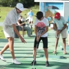 Max Margolis teaches victims of terrorism how to play golf. The Caesarea Golf Club, Sept. 15, 2024. Credit: Meir Pavlovsky.