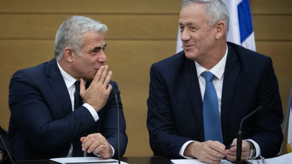 Then-Blue and White Party leaders Yair Lapid (left) and Benny Gantz attend a faction meeting at the opening of the 22nd Knesset in Jerusalem, Oct. 3, 2019. Photo by Hadas Parush/Flash90.