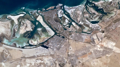 An aerial view of Abu Dhabi, capital of the United Arab Emirates. Credit: NASA.