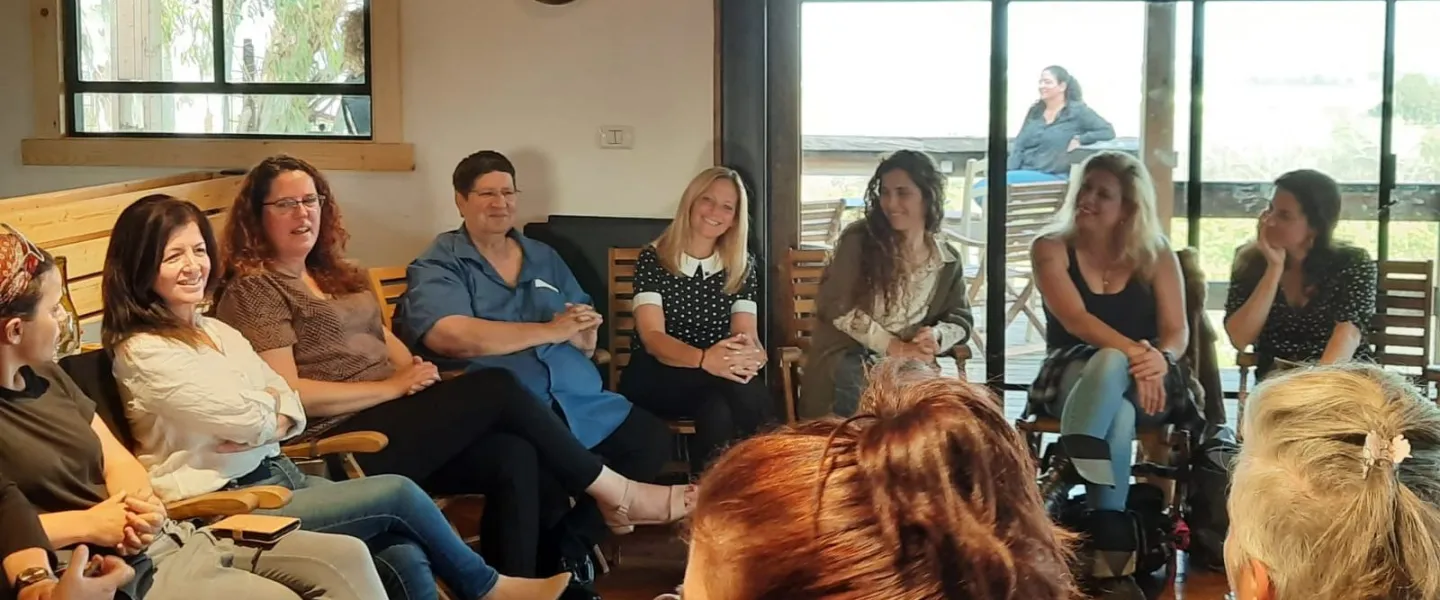 Participants of the kibbutz female leadership program meet with the Kibbutz Movement’s Secretary-General Nir Meir (in blue). Credit: Hilit Ben Zvi.