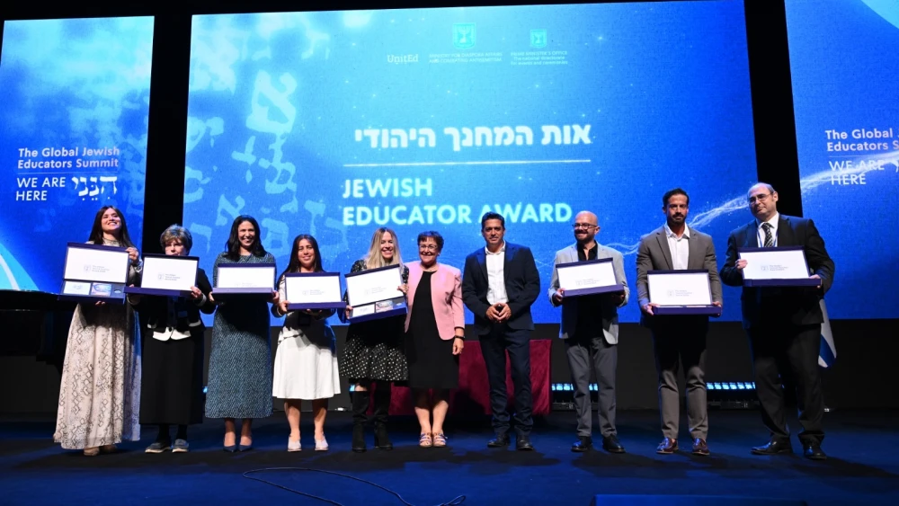 The eight recipients of the inaugural Global Jewish Teacher Award at the Global Jewish Educator Conference in Jerusalem, Oct. 12, 2026. From right: Rabbi Zvi Lew, United States; Tal Kattan, South Africa; Meir Bunytow, Mexico; Anat Kampf, United States; Raquel Hakim, Argentina; Dina Jacobson, Britain; Marina Grushevskaya, Russia; and Rahel Israeloevitch, France. Photo by Yuval Yosef/GPO.