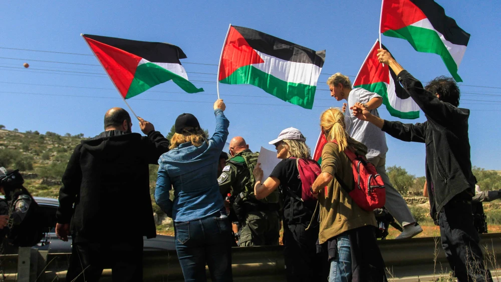 Left-wing protesters hold PLO flags in Huwara, near Nablus in Samaria, March 3, 2023. Photo by Nasser Ishtayeh/Flash90.