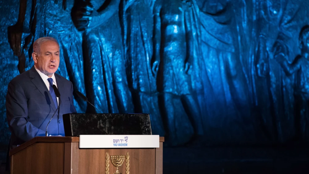 Israeli Prime Minister Benjamin Netanyahu speaks at the official state ceremony held at the Yad Vashem Holocaust Memorial Museum in Jerusalem, as Israel marks annual Holocaust Remembrance Day on April 11, 2018. Photo by Yonatan Sindel/Flash90.