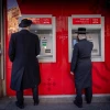Men at ATM machines in the haredi neighborhood of Mea Shearim in Jerusalem, Feb. 5, 2024. Photo by Chaim Goldberg/Flash90.