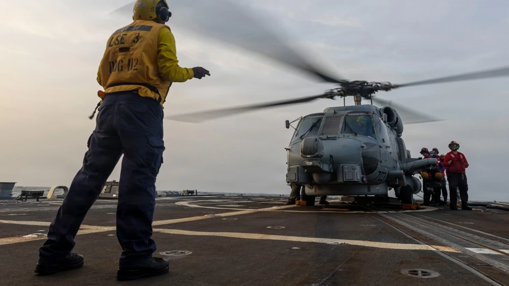 A U.S. Navy MH-60R Sea Hawk helicopter is readied for flight aboard the guided-missile destroyer USS Michael Murphy as the warship supports the U.S. blockade of Iran in regional waters. Credit: United States Central Command.