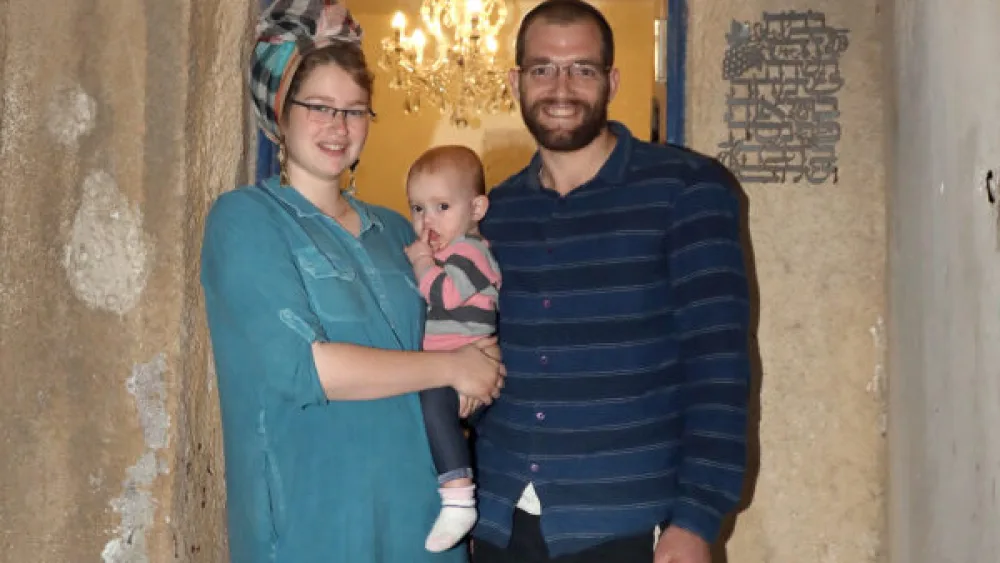 Moriah and Elazar Cohen and their infant daughter. Credit: Courtesy.