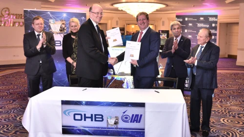 Opher Doron (right), general manager of IAI's Space Division, shakes hands with Marcho Fuchs, CEO of OHB Systems AG, at the David Intercontinental hotel in Tel Aviv, on Jan. 29. In the background are Johann-Dietrich Wörner, director general of European Space Agency (left); Professor Pascale Ehrenfreund, chair of the executive board of the German Space Agency (DLR); Avi Blasberger, director general of Israel Space Agency; and SpaceIL's Morris Kahn. Credit: Courtesy.