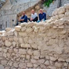 The wall of Jerusalem as uncovered in the excavations of the Israel Antiquities Authority, with, from left, Ortal Chalaf, Dr. Filip Vukosavovich and Dr. Joe Uziel. Photo by Kobi Harati/City of David Foundation.
