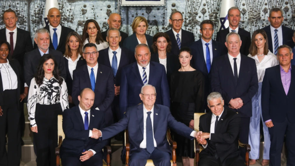 Israeli Prime Minister Naftali Bennett, Foreign Minister Yair Lapid, President Reuven Rivlin and other ministers pose for a group photo of the country’s 36th government, at the President's Residence in Jerusalem, June 14, 2021. Photo by Yonatan Sindel/Flash90.