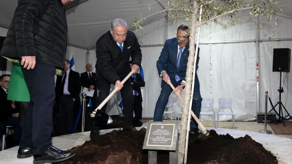 Israeli Prime Minister Benjamin Netanyahu leads a tree-planting ceremony in honor of Tu Bishvat in the Neve Ya'akov neighborhood of Jerusalem, Feb. 6, 2023. Credit: Amos Ben-Gershom/GPO.