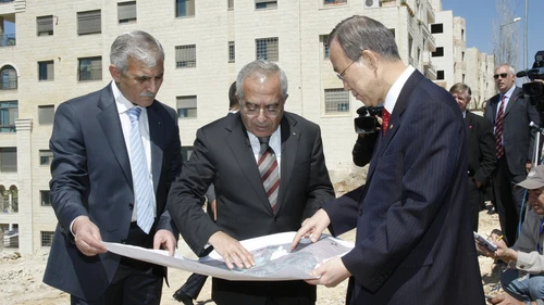 UN Secretary-General Ban Ki-moon (right) and Salam Fayyad (center), former Prime Minister of the Palestinian National Authority, look over a map during their visit to the West Bank's Area C, outside Ramallah. A new World Bank report, entitled “Area C and the Future of the Palestinian Economy,” blames Israel for shortcomings within the Palestinian economy. Credit: UN Photo/Mark Garten.