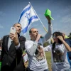 Supporters of Elor Azaria, the Israeli soldier convicted of manslaughter for shooting neutralized Palestinian terrorist Abdel Fattah al-Sharif last year in Hebron, demonstrate outside the Knesset March 15, 2017. Credit: Miriam Alster/Flash90.