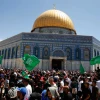 People wave Hamas flags outside the Dome of the Rock in Jerusalem, May 7, 2021. Photo by Jamal Awad/Flash90.