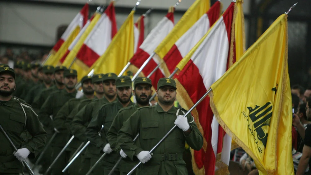 Hezbollah fighters march in a ceremony. Credit: Wikimedia Commons.