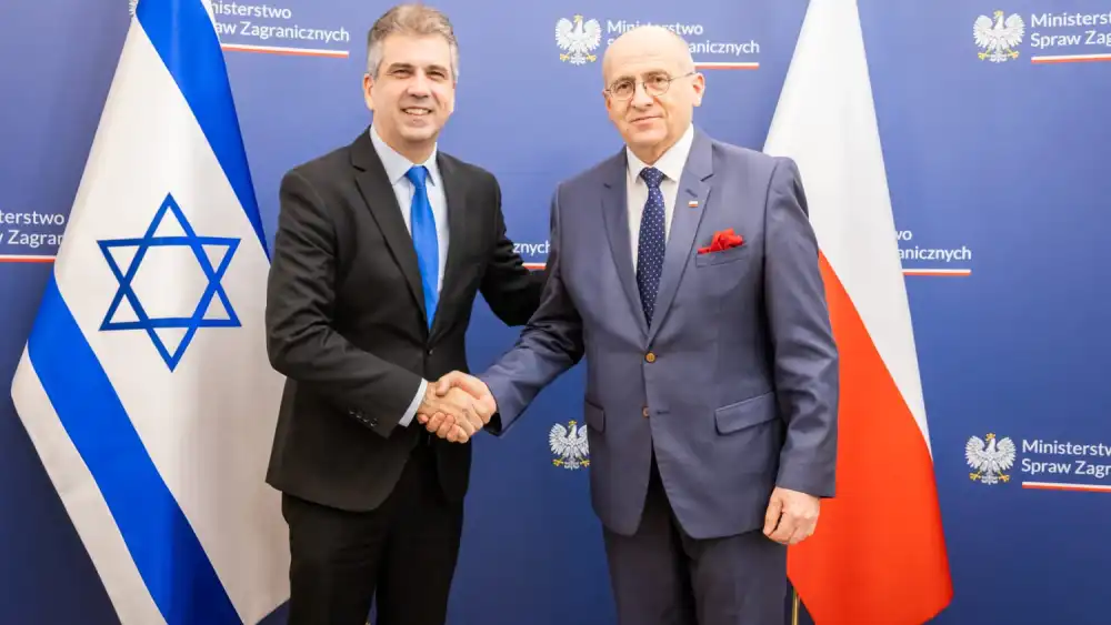 Israeli Foreign Minister Eli Cohen (left) meets with Polish Foreign Minister Zbigniew Rau in Warsaw, March 22, 2023. Credit: Israeli Foreign Ministry via Twitter.