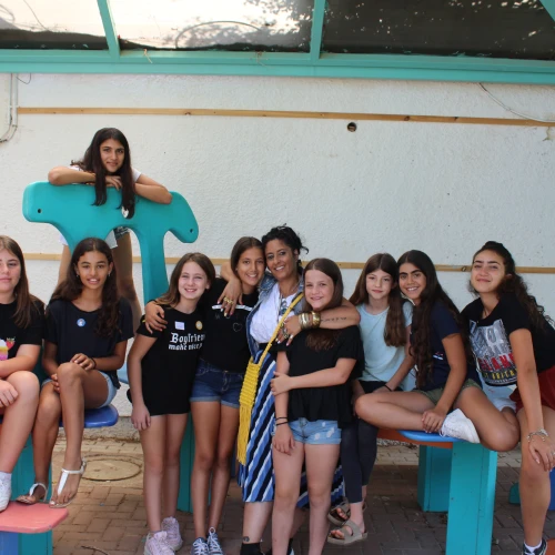 A group of 12-year-olds at the Yuvalei Ha-Bsor School summer camp with their senior adult educator (center) Limor Or, July 2019. Photo by Eric Narrow/JNF.