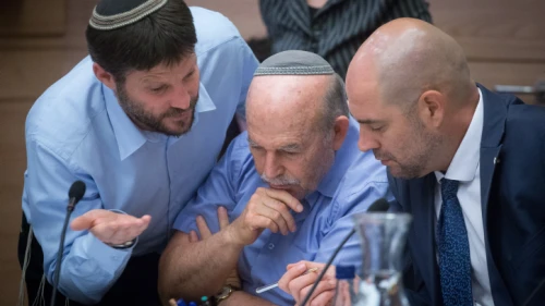 Interim Justice Minister Amir Ohana (right) with Jewish Home parliament members Nissan Slomiansky (center) and Bezalel Smotrich at the joint Knesset and Constitution Committee meeting discussing the proposed National Law at the Knesset, July 16, 2018. Photo by Miriam Alster/Flash90.