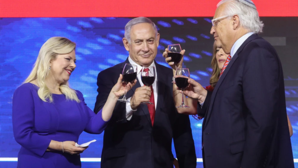 Prime Minister Benjamin Netanyahu, his wife, Sara, and U.S. Ambassador to Israel David Friedman attend an American Independence Day celebration in Jerusalem on July 2, 2019. Photo by Marc Israel Sellem/POOL.