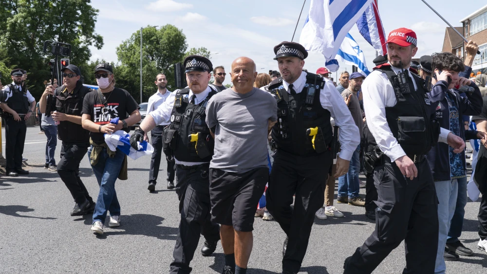A man is arrested at an anti-Israel protest at Edgware United Synagogue in London, the U.K. on June 14, 2026. Photo by Denise Baker/Getty Images.