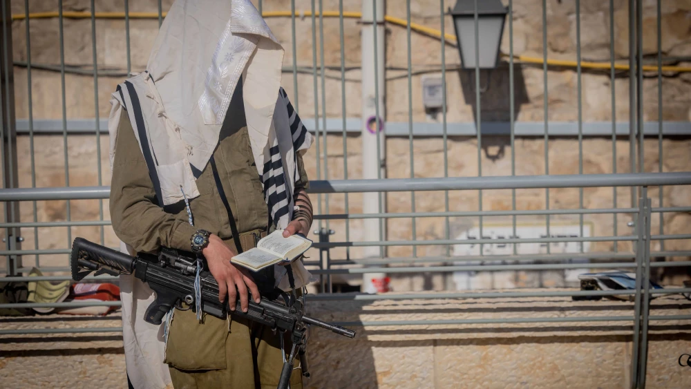 Ultra-Orthodox Jewish soldiers from the Hasmonean Brigade take part in a beret march after completing seven months of basic and advanced training, at the Western Wall in Jerusalem's Old city on Aug. 6, 2025. Photo by Chaim Goldberg/Flash90.