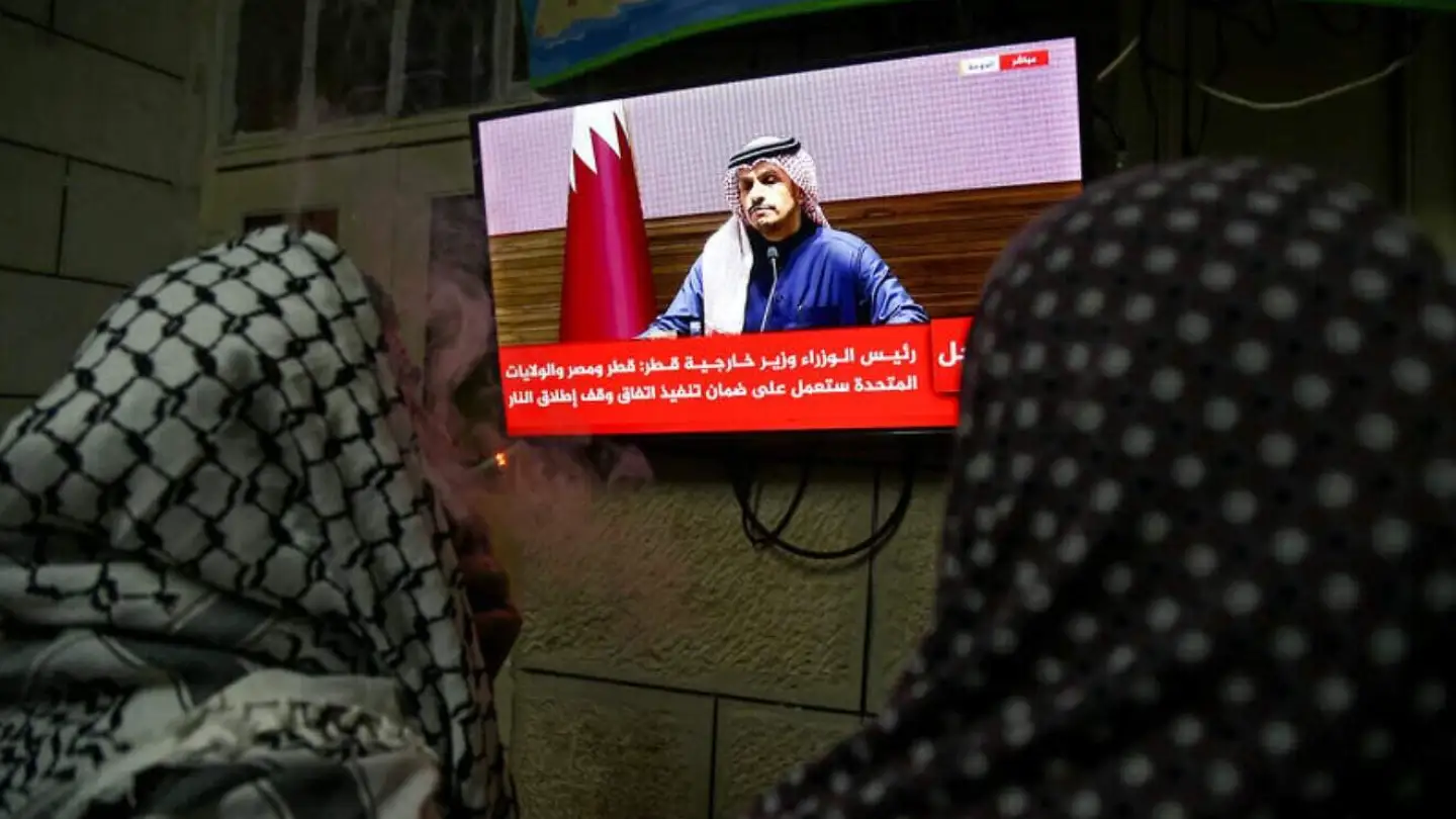 Palestinians watch a press conference of Qatar’s Prime Minister Sheikh Mohammed bin Abdulrahman bin Jassim Al Thani on the ceasefire deal between Israel and Hamas, in the West Bank city of Hebron, January 15, 2025. Photo by Wisam Hashlamoun/Flash90