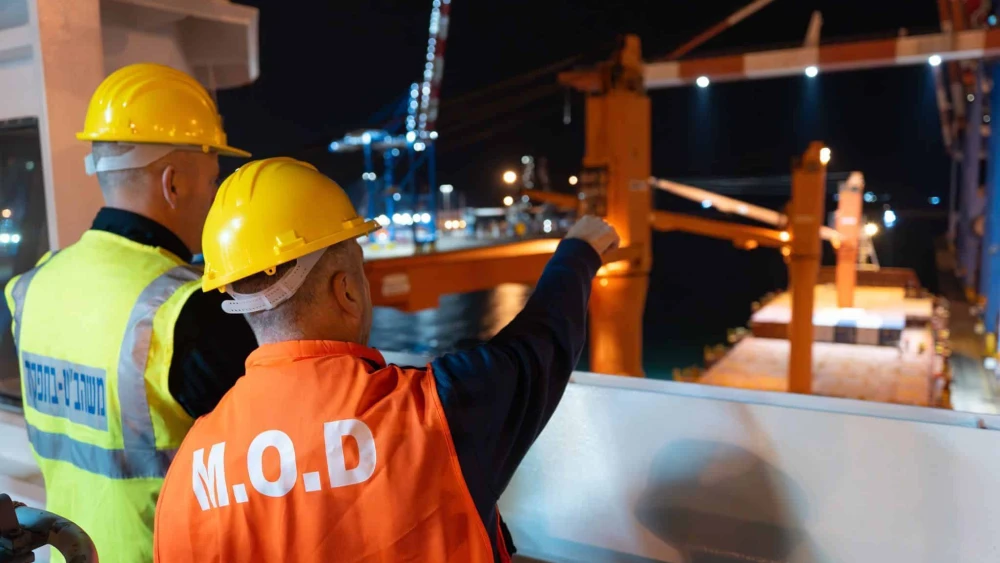 Israeli Defense Ministry personnel coordinate the arrival of U.S. MK-84 heavy bombs to the Port of Ashdod on Feb. 15, 2025. Photo credit: Israel Ministry of Defense.