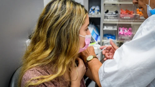 An Israeli young woman receives a COVID-19 vaccine in Tel Aviv, June 22, 2021. Photo by Avshalom Sassoni/Flash90.