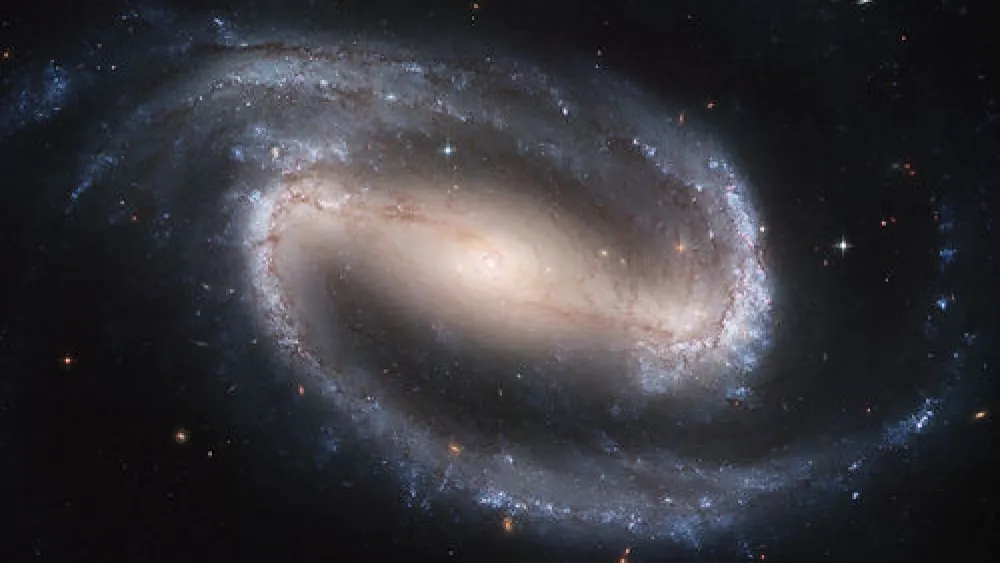 NGC 1300, a spiral galaxy, as photographed by the Hubble telescope. Credit: NASA, ESA, and The Hubble Heritage Team STScI/AURA.