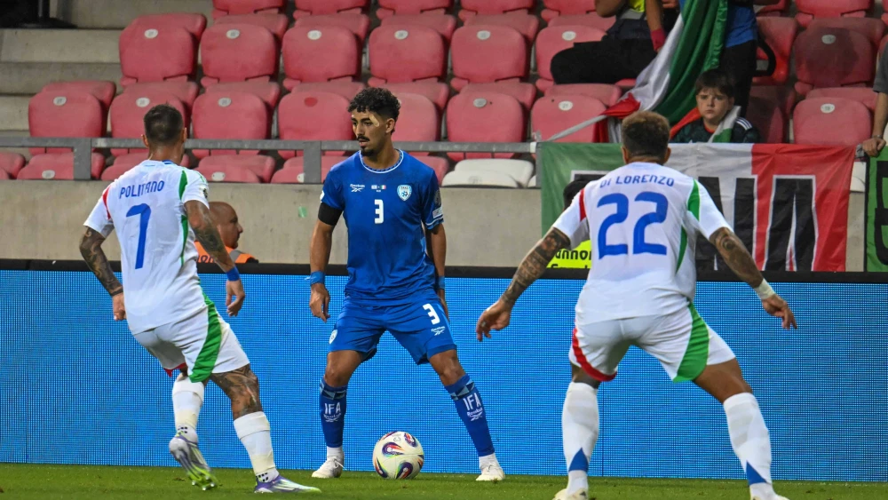 Israel national team left-back Roy Revivo faces off against Italian players during an Israeli "home" game World Cup qualifying match at Nagyerdei Stadion in Debrecen, Hungary, on Sept. 8, 2025. Credit: Flash90.