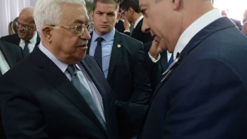Israeli Prime Minister Benjamin Netanyahu meets with Palestinian Authority leader Mahmoud Abbas during the funeral of late Israeli President Shimon Peres, held at Mount Herzl in Jerusalem on Sept. 30, 2016. Credit: Amos Ben Gershom/GPO.