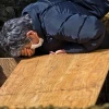 A man is grief-stricken after the earthquake and tsunamis devastate Japan in March. Rabbi Kushner guides the way to facing God after suffering tragedy and the loss of loved ones. Credit: Douglas Sprott.