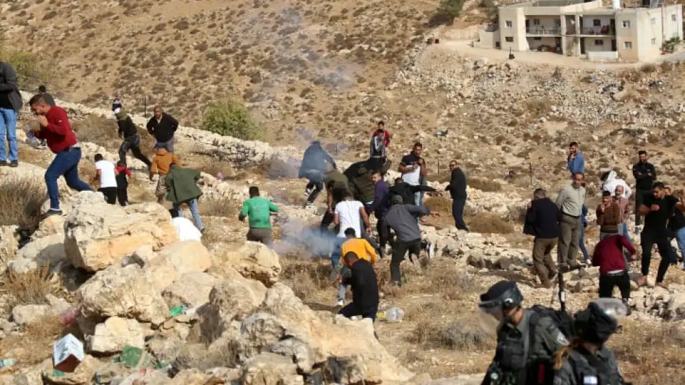 Palestinians clash with Israeli security forces as a bulldozer demolishes a Palestinian house in Hebron, Oct. 25, 2022. Photo by Wisam Hashlamoun/Flash90.