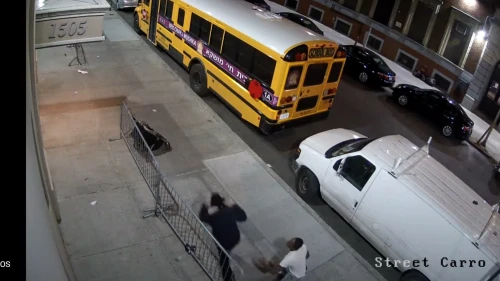Surveillance video footage shared by the Jewish news outlet COLlive shows the attacker crossing the street and approaching two Jewish men standing outside a yeshivah dormitory on Jan. 22, 2022. Source: Screenshot.