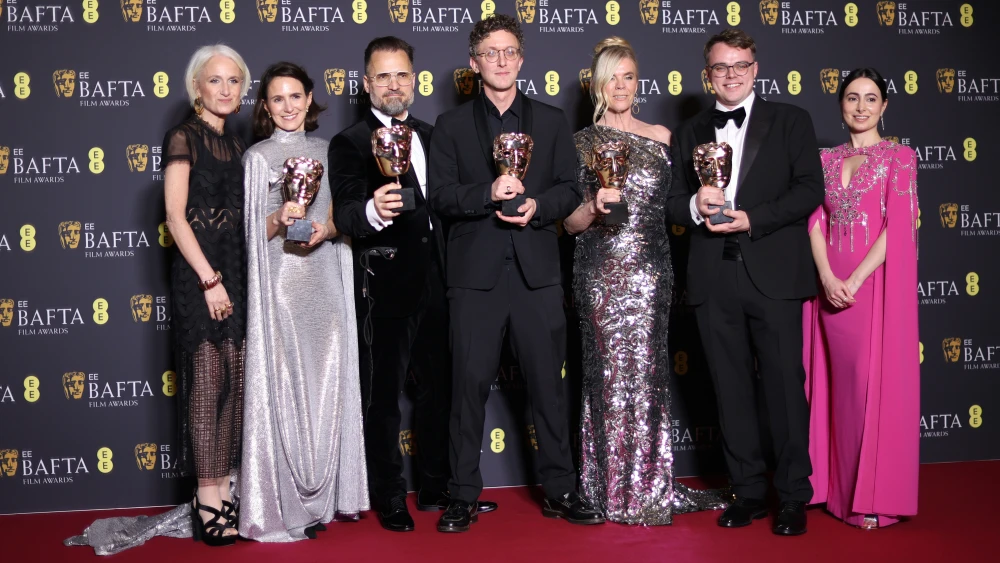Lucie Kon, left, and Alžběta Karásková, Radovan Sibrt, David Borenstein, Pavel Talankin, Helle Faber and Shabnur Gayibova with the Best Documentary Award for "Mr Nobody Against Putin" during the 2026 EE BAFTA Film Awards at The Royal Festival Hall on February 22, 2026 in London, England. Photo by Mike Marsland/WireImage.