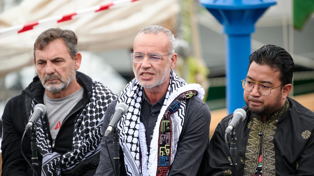 Aziz Ghali, center, attends the press conference prior to The Spring 2026 Global Sumud Flotilla setting sail to Gaza on April 12, 2026 in Barcelona, Spain. Photo by Mario Wurzburger/Getty Images.
