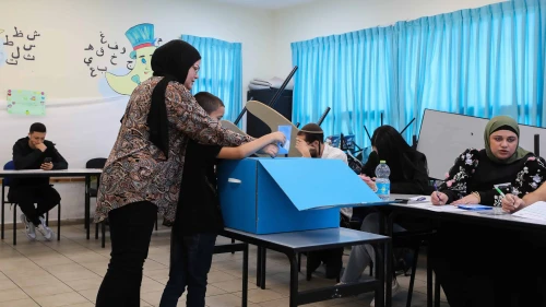A woman casts her ballot at a voting station in Tayibe, in the Triangle region, during the Knesset election on Nov. 1, 2022. Photo by Jamal Awad/Flash90.