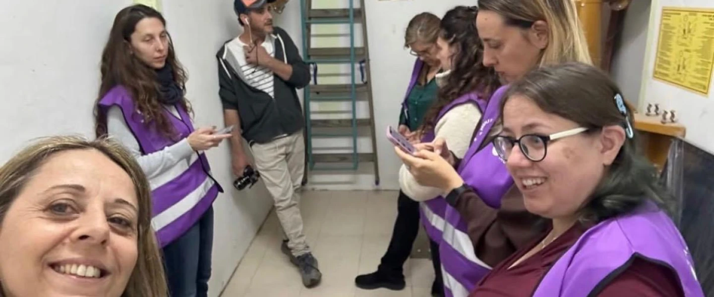 Members of the Purple Vest Mission team take shelter during a siren in a shelter in Kfar Saba, March 2026. Credit: Access Israel.