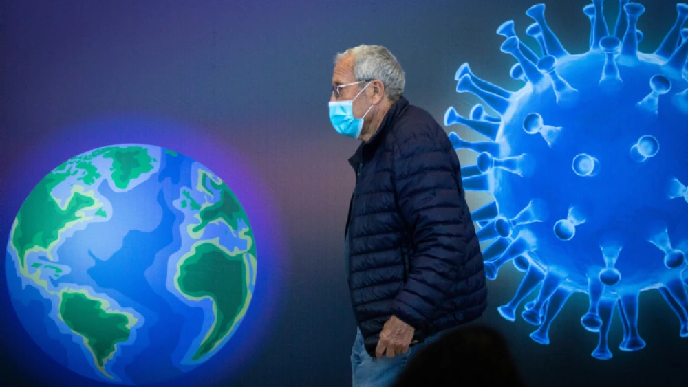 An Israeli man passes by a COVID-19 vaccination center in Jerusalem on Jan. 4, 2021. Photo by Olivier Fitoussi/Flash90.