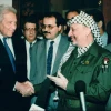 Late Palestinian president Yasser Arafat with late Israeli president Ezer Weizman and Knesset member Ahmad Tibi, in Pretoria, South Africa in 1994. Photo by Moshe Shai/FLASH90.